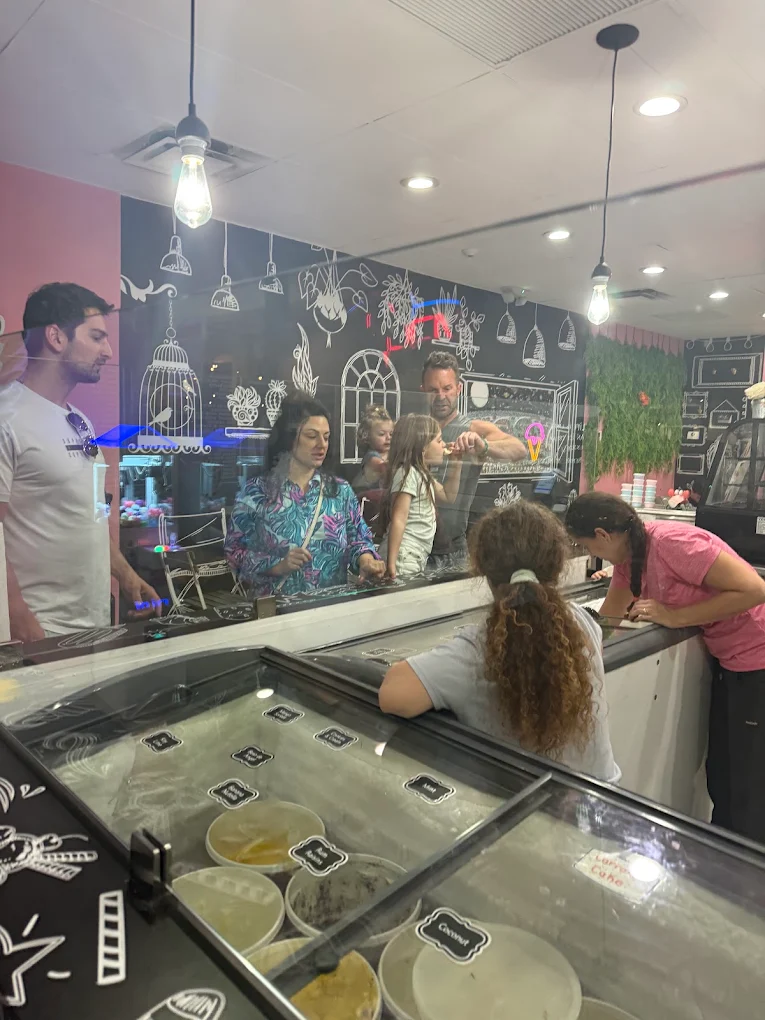 Customers picking flavors at the Rosa Ice Cream counter in Jupiter, FL