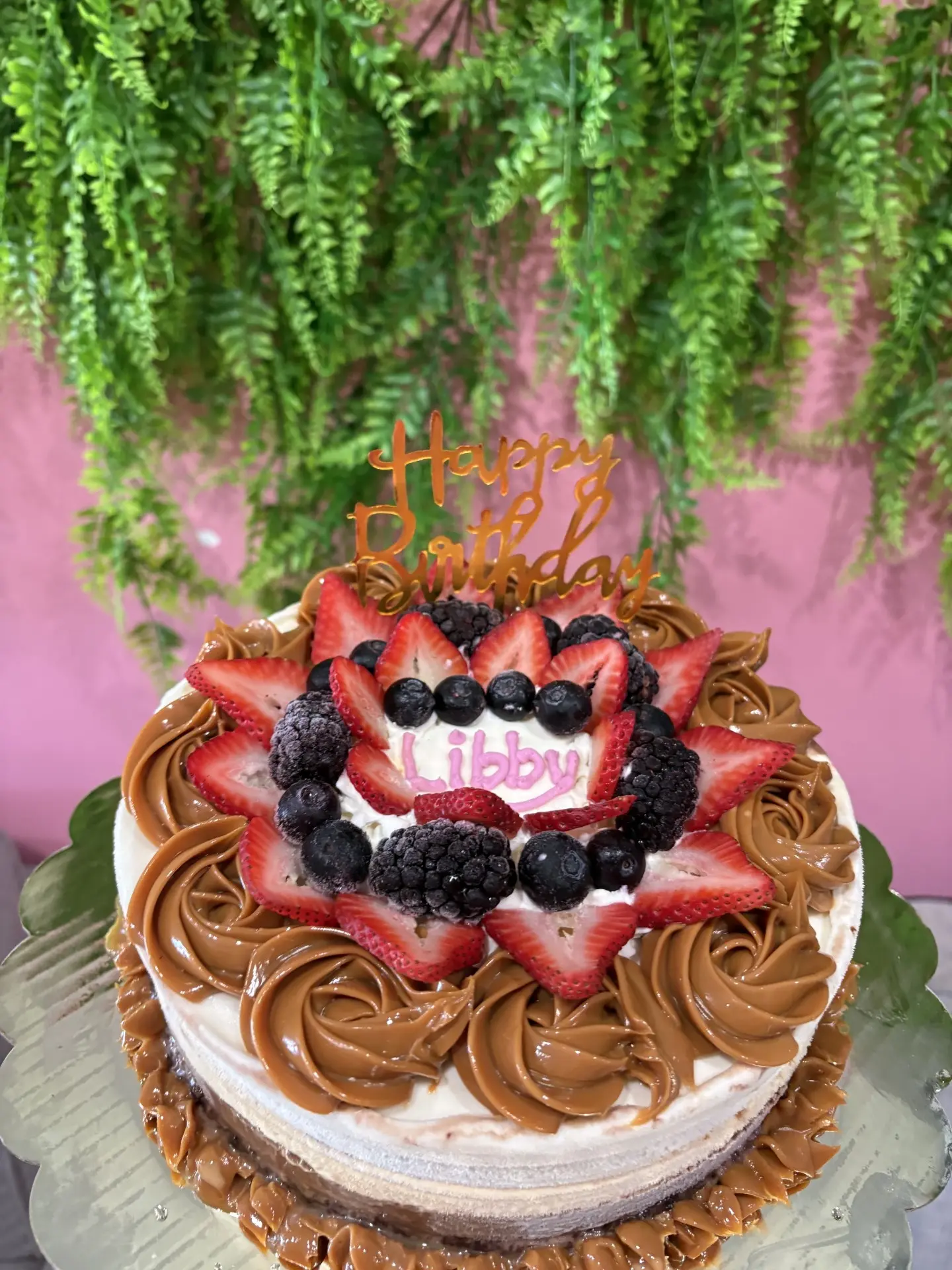 Dulce de leche ice cream cake topped with fresh berries