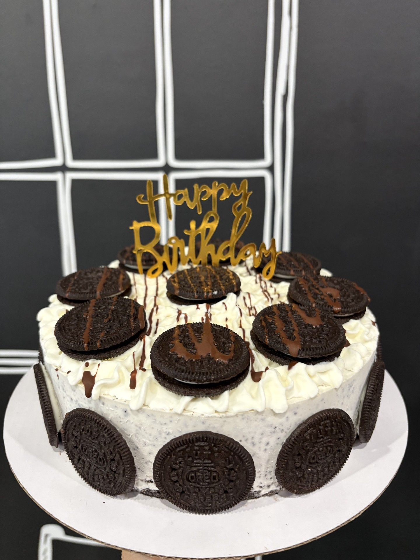 Cookies and cream ice cream cake decorated with Oreos